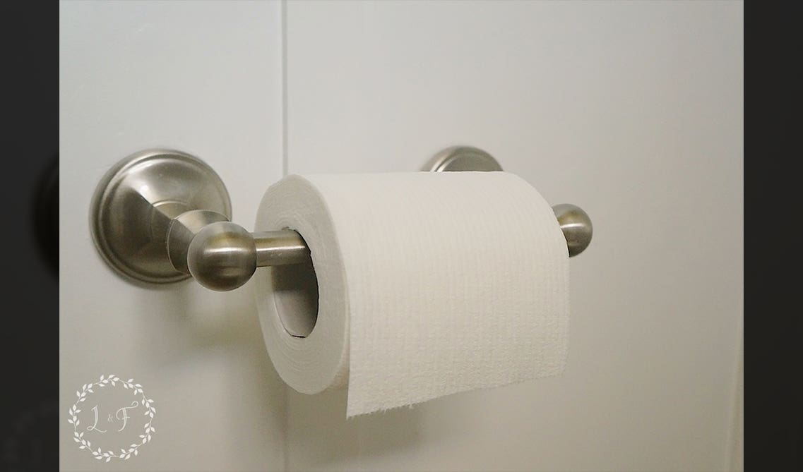 toilet paper roll on steel handle 