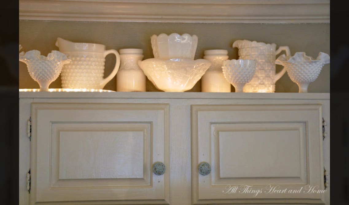 white cabinets with unique show pieces